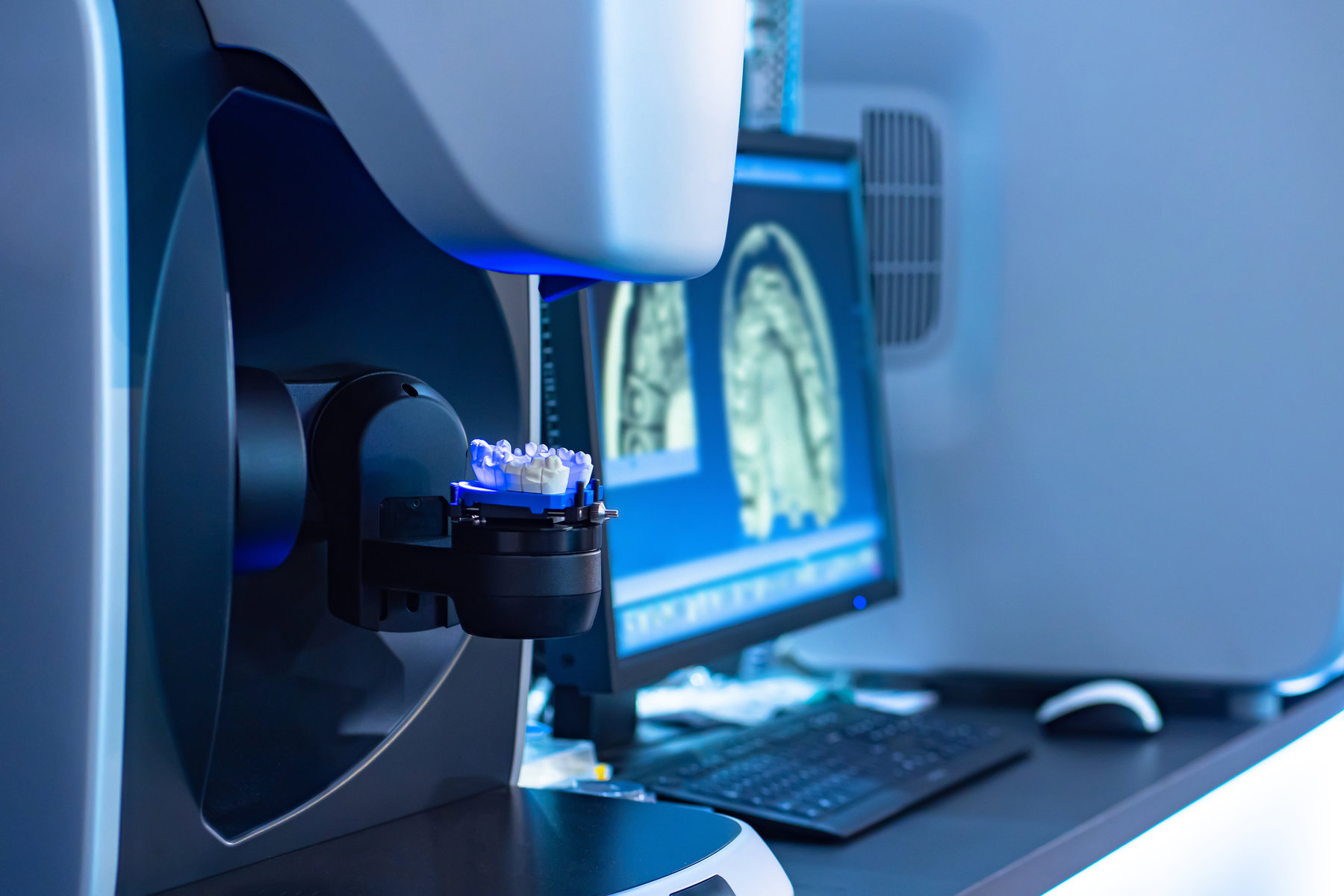 Workplace dental technician. Production of dental crowns. Milling dental system with computer control. Grinding and milling machine of dentures. Laboratory milling cutter for dental work. Dentistry.